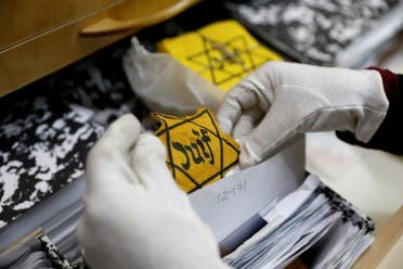 An original yellow star (not on general display) is seen at the artifacts department of the Yad Vashem World Holocaust Remembrance Center in Jerusalem, ahead of the Israeli annual Holocaust Remembrance Day, April 10, 2018. Picture taken April 10, 2018. (Reuters)