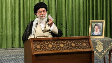 This handout picture provided by the office of Iran's Supreme Leader Ayatollah Ali Khamenei on May 27, 2021 shows him addressing parliament members during an online meeting in the Iranian capital Tehran, with a picture of his predecessor, the late Ayatollah Ruhollah Khomieni next to him. Khamenei urged Iranians to ignore calls to boycott next month's presidential election, after several hopefuls were barred from running against ultraconservative candidates. Iran is set to elect a successor to President Hassan Rouhani on June 18 amid widespread discontent over a deep economic and social crisis.