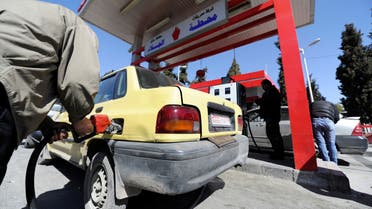 A man fills the tank of a car at a petrol station in Damascus, Syria , February 19, 2017. Picture taken February 19, 2017. REUTERS/Omar Sanadiki