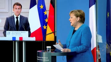 French President Emmanuel Macron is seen on a video screen during a joint press conference with German Chancellor Angela Merkel, as part of a virtual Plenary Session of the Franco-German Council of Ministers in Berlin, Germany, May 31, 2021. Michael Sohn/Pool via REUTERS