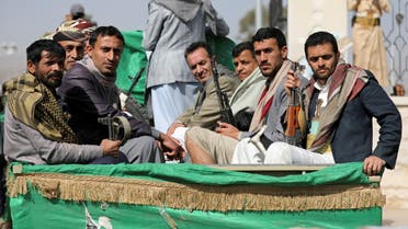 FILE PHOTO: Armed Houthi followers ride on the back of a truck after participating in a funeral of Houthi fighters killed in recent fighting against government forces in Yemen's oil-rich province of Marib, in Sanaa, Yemen February 20, 2021. REUTERS/Khaled Abdullah/File Photo/File Photo