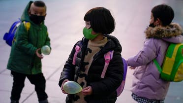Children wearing face masks are seen at Shanghai railway station as the country is hit by an outbreak of the novel coronavirus, in Shanghai. (Reuters)