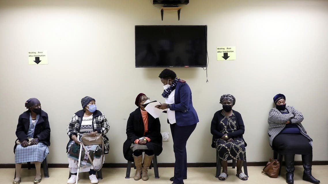 A nurse talks to a woman following her vaccination, as South Africa rolls out the coronavirus disease (COVID-19) vaccines to the elderly at the Munsieville Care for the Aged Centre outside Johannesburg, South Africa May 17, 2021. (Reuters)