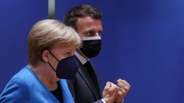French President Emmanuel Macron and German Chancellor Angela Merkel attend a face-to-face EU summit in Brussels, Belgium, May 24, 2021. REUTERS/Yves Herman/Pool