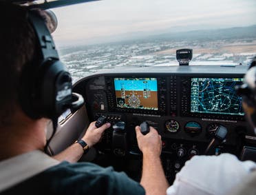 A pilot flying an aircraft. (Unsplash, Kristopher Allison)
