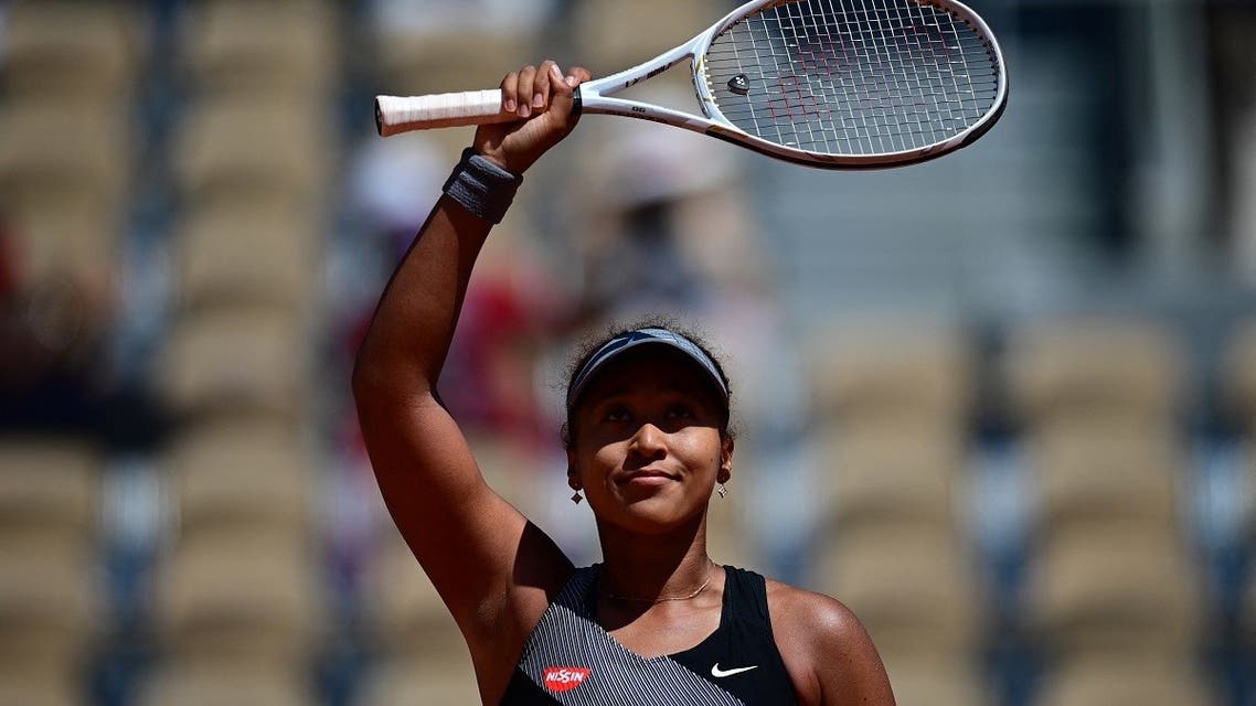 Japan's Naomi Osaka celebrates after winning against Romania's Patricia Maria Tig during their women's singles first round tennis match on Day 1 of The Roland Garros 2021 French Open tennis tournament in Paris. (AFP)