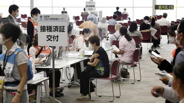 Senior citizens wait to receive a coronavirus disease (COVID-19) vaccine at a large-scale coronavirus disease (COVID-19) vaccination centre in Osaka, western Japan May 24, 2021, in this photo distributed by Kyodo. (Reuters)
