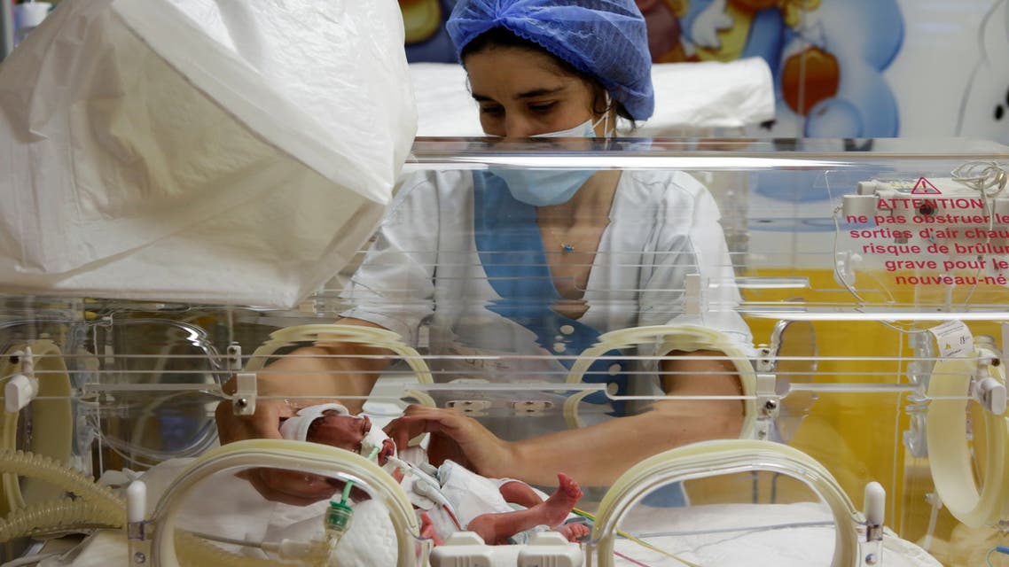 A nurse walks inside a maternity ward where the newborn nonuplets are, at the private clinic of Ain Borja in Casablanca, Morocco May 5, 2021. REUTERS/Youssef Boudlal