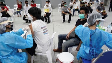 People receive China's Sinovac coronavirus disease (COVID-19) vaccine at the Central Vaccination Center, inside the Bang Sue Grand Station, in Bangkok, Thailand, May 24, 2021. REUTERS/Athit Perawongmetha