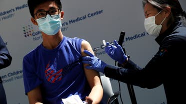 Thomas Lo (15) receives a dose of the Pfizer-BioNTech vaccine for the coronavirus disease (COVID-19) at Northwell Health's Cohen Children's Medical Center in New Hyde Park, New York, U.S., May 13, 2021. REUTERS/Shannon Stapleton