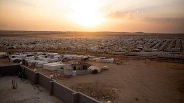 In this Aug. 24, 2019 photo, the sun sets over Sharia Camp, where Yazidis displaced by Islamic State militants are housed near Dohuk, Iraq. (AP)