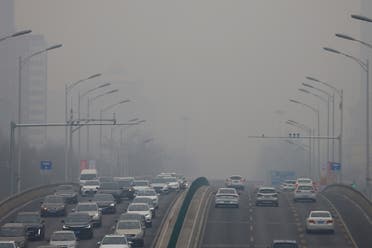 Cars move on a road during a day with polluted air, following the outbreak of the coronavirus disease (COVID-19), in Beijing, China February 13, 2021. (File photo: Reuters)