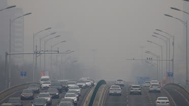 Cars move on a road during a day with polluted air, following the outbreak of the coronavirus disease (COVID-19), in Beijing, China February 13, 2021. (File photo: Reuters)
