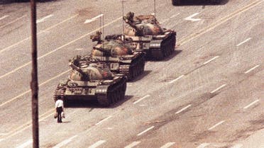 A man stands in front of a convoy of tanks in the Avenue of Eternal Peace in Tiananmen Square in Beijing in this June 5, 1989 file photo. (Reuters)