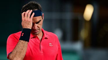 Switzerland’s Roger Federer reacts as he plays against Germany’s Dominik Koepfer during their men’s singles third round tennis match on Day 7 of The Roland Garros 2021 French Open tennis tournament in Paris on June 5, 2021. (Martin Bureau/AFP)