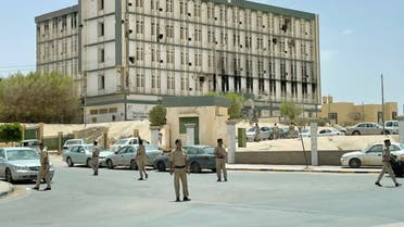 Libyan security members are seen in front of the Administrative complex in Bani Walid town, Libya, May 20, 2021. Picture taken May 20, 2021. (Reuters/Ahmed Elumami)