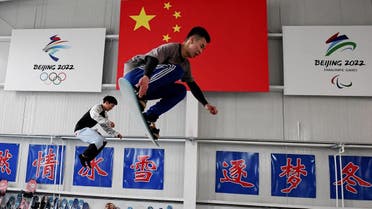 Students train at a Youth Winter Olympic Sports School in Zhangjiakou, one of the venues for the 2022 Winter Olympics, on the border of Beijing in northern China's Hebei province on March 18, 2021. (STR/AFP)