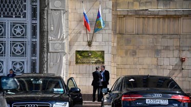 A file photo shows two men chat as they stand outside the main building of the Russian Foreign Ministry in Moscow on July 31, 2017. (Alexander Nemenov/AFP)