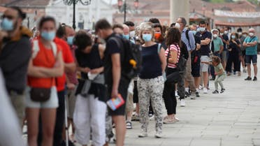 People queue to enter San Marco Dome, as the region of Veneto becomes a “white zone,” following a relaxation of COVID-19 restrictions with only masks and social distancing required, in Venice, Italy, June 7, 2021. (Reuters/Yara Nardi)