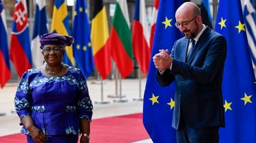 European Council President Charles Michel, right, welcomes Director-General of the World Trade Organization Ngozi Okonjo-Iweala prior to a meeting at the European Council building in Brussels, on May 19, 2021. (AP)