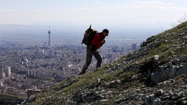 A hiker ascend a foothill of the Alborz mountain range, overlooking the capital Tehran. (File photo: AP)