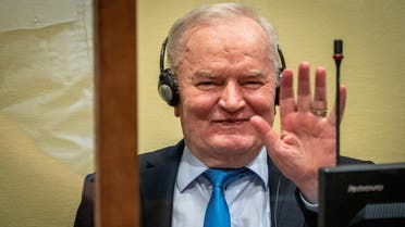 Former Bosnian Serb military leader Ratko Mladic waves in the courtroom prior to the pronouncement of his appeal judgement at the UN International Residual Mechanism for Criminal Tribunals (IRMCT) in The Hague, Netherlands June 8, 2021. Jerry Lampen/Pool via REUTERS