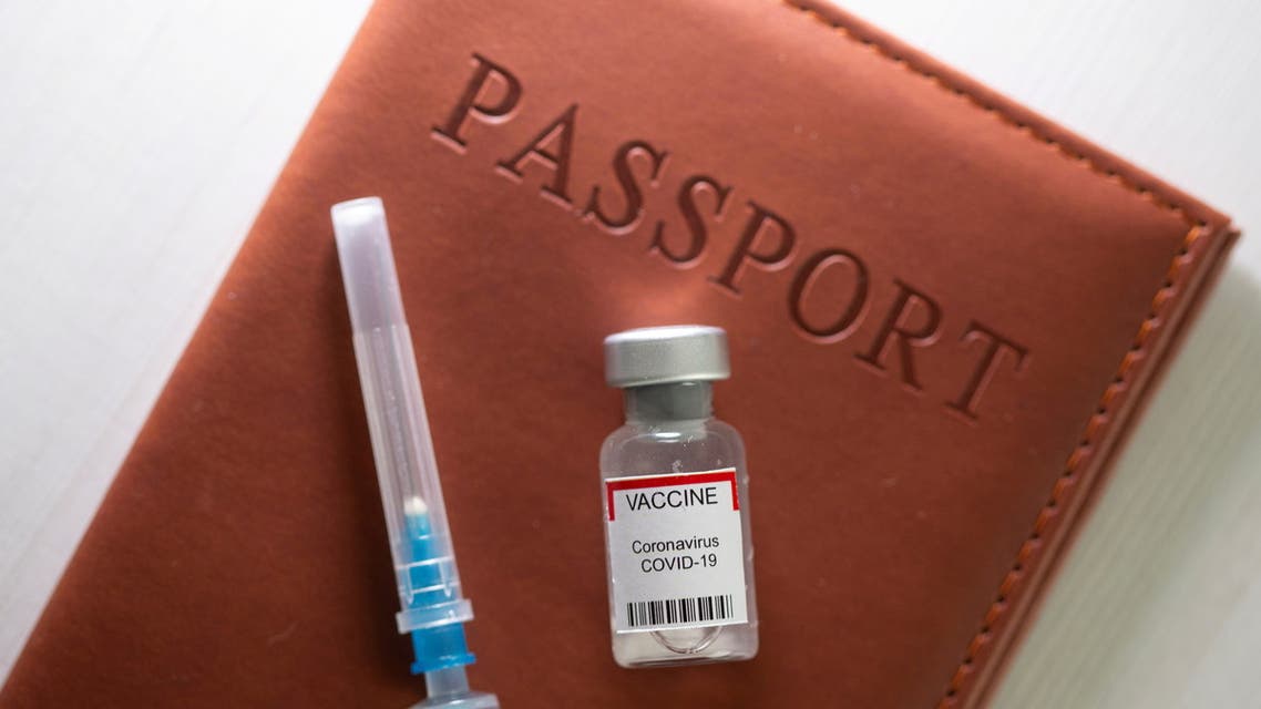 \A syringe and a vial labelled coronavirus disease (COVID-19) vaccine are placed on a passport in this illustration taken April 27, 2021. (File Photo: Reuters)