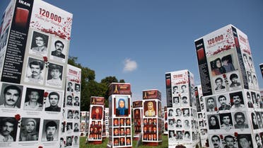 Thousands of photos of people killed in Iran during the 1988 massacre of political prisoners as well as during more recent anti-regime uprisings, during a photo exhibit by the Organization of the Iranian American Communities to highlight human rights violations by the country, near the US Capitol in Washington, DC, September 4, 2020. (File photo: AFP)