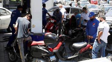 A worker fills up a motorbike with fuel at a gas station in Beirut, Lebanon June 3, 2021. (Reuters)