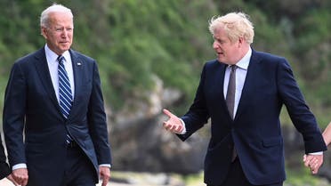  US President Joe Biden, left, talks with Prime Minister Boris Johnson, during a walk, with their wives (not pirctured) outside Carbis Bay Hotel, Carbis Bay, Cornwall, Britain, ahead of the G7 summit, Thursday June 10, 2021. (AP)