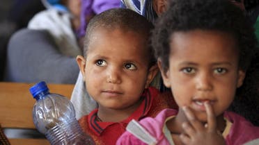 Eritrean refugee children wait to get registered on arrival at Indabaguna refugee reception and screening center in Tigrai region near the Eritrean border in Ethiopia, February 9, 2016. (Reuters)