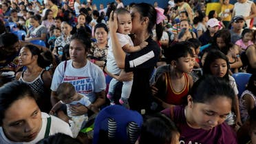Mothers hold their children while waiting in line to receive free polio vaccine during a government-led mass vaccination program in Quezon City, Metro Manila, Philippines, October 14, 2019. (Reuters)