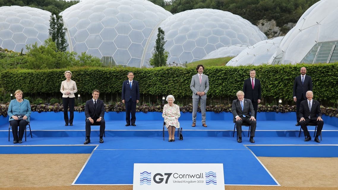 Britain's Queen Elizabeth II (C), poses for a familly photograph with, from left, Germany's Chancellor Angela Merkel, President of the European Commission Ursula von der Leyen, France's President Emmanuel Macron, Japan's Prime Minister Yoshihide Suga, Canada's Prime Minister Justin Trudeau, Britain's Prime Minister Boris Johnson , Italy's Prime minister Mario Draghi, President of the European Council Charles Michel and US President Joe Biden, during an evening reception at The Eden Project in south west England on June 11, 2021. G7 leaders from Canada, France, Germany, Italy, Japan, the UK and the United States meet this weekend for the first time in nearly two years, for three-day talks in Carbis Bay, Cornwall. (AFP)