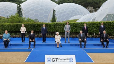 Britain's Queen Elizabeth II (C), poses for a familly photograph with, from left, Germany's Chancellor Angela Merkel, President of the European Commission Ursula von der Leyen, France's President Emmanuel Macron, Japan's Prime Minister Yoshihide Suga, Canada's Prime Minister Justin Trudeau, Britain's Prime Minister Boris Johnson , Italy's Prime minister Mario Draghi, President of the European Council Charles Michel and US President Joe Biden, during an evening reception at The Eden Project in Cornwall, England on June 11, 2021. (AFP)