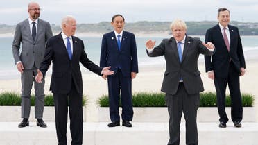 US President Joe Biden, Britain's Prime Minister Boris Johnson, European Council President Charles Michel, Japan's Prime Minister Yoshihide Suga and Italy's Prime Minister Mario Draghi stand for a family photo during the G7 summit in Carbis Bay, Cornwall, Britain, on June 11, 2021. (Reuters)