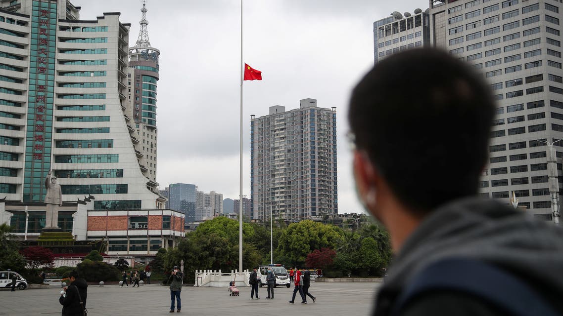 The Chinese national flag flies at half-mast at Zhucheng Square in Guiyang, Guizhou province, as China holds a national mourning for those who died of the coronavirus disease (COVID-19), on the Qingming tomb-sweeping festival, April 4, 2020. (Reuters)