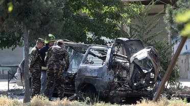 Afghan security forces inspect the wreckage of a passenger van after a blast in Kabul, Afghanistan June 12, 2021. (Reuters)