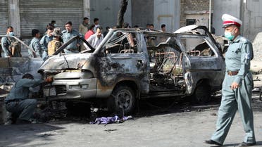 Afghan security forces inspect the wreckage of a passenger van after a blast in Kabul, Afghanistan June 12, 2021. (Reuters)