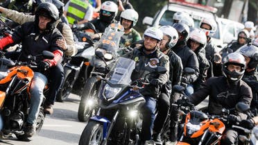 Brazil’s President Jair Bolsonaro, center, takes part in a caravan of motorcycle enthusiasts who gathered in a show of support for Bolsonaro, in Sao Paulo, Brazil, June 12, 2021. (AP/Marcelo Chello)
