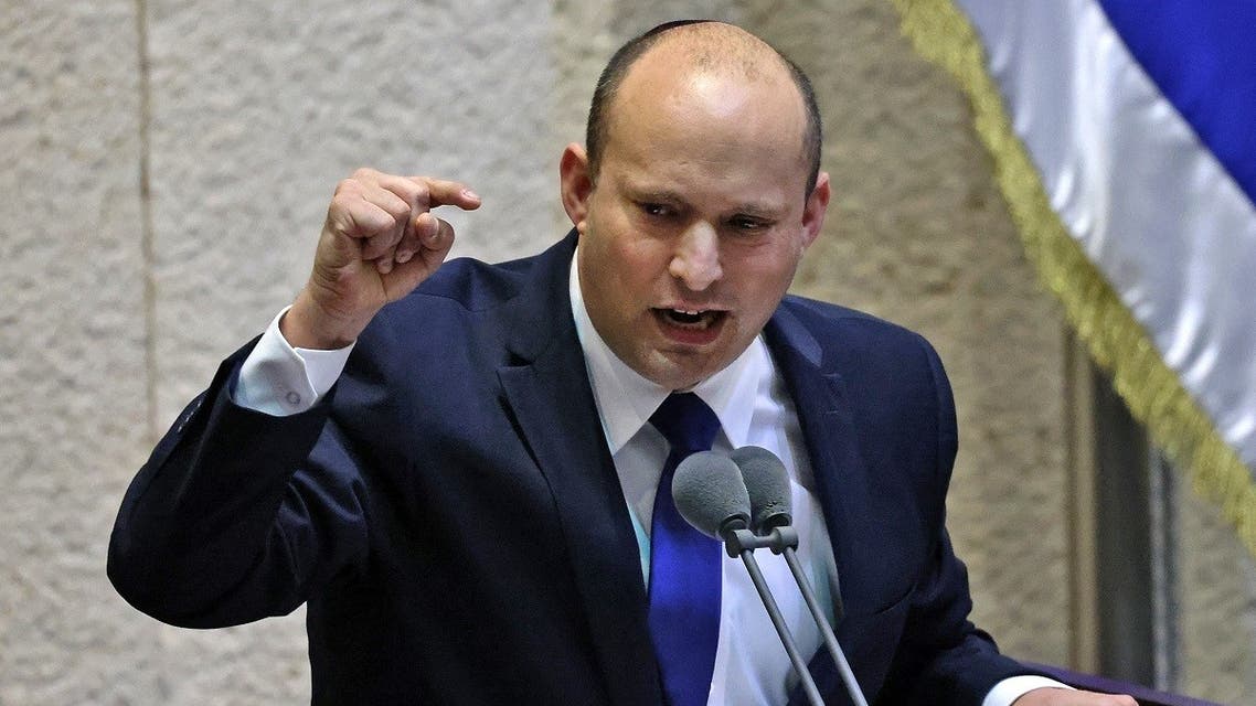 Naftali Bennett addresses lawmakers during a special session to vote on a new government at the Knesset in Jerusalem, on June 13, 2021. (Emmanuel Dunand/AFP)