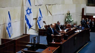 Israel's designated new prime minister Naftali Bennett speaks during a Knesset session in Jerusalem Sunday, June 13, 2021. (AP)