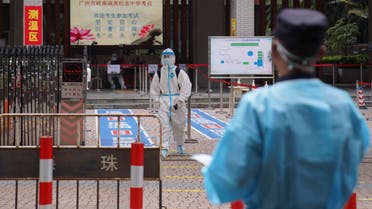 A student in full protective gear leaves after taking the college entrance exams in a special quarantined exam station for students who had close contacts with recent coronavirus cases in Guangzhou, China, on Monday, June 7, 2021. Residents of Guangzhou will not be able to leave unless they can show that it is absolutely necessary to do so, following an outbreak of COVID-19 that has sickened dozens of people in recent days. (AP Photo)