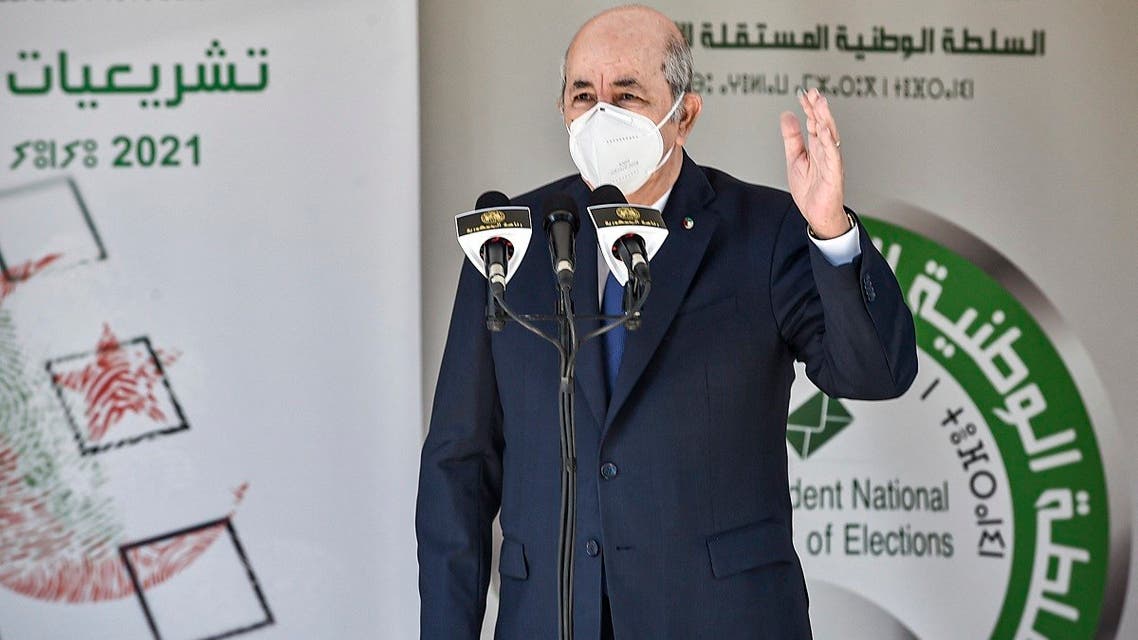 Algeria’s President Abdelmadjid Tebboune speaks outside a polling station in Bouchaoui, on the western outskirts of Algeria’s capital Algiers, on June 12, 2021 during the 2021 parliamentary elections. (Ryad Kramdi/AFP)
