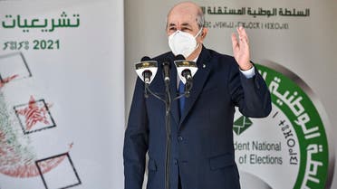 Algeria’s President Abdelmadjid Tebboune speaks outside a polling station in Bouchaoui, on the western outskirts of Algeria’s capital Algiers, on June 12, 2021 during the 2021 parliamentary elections. (Ryad Kramdi/AFP)