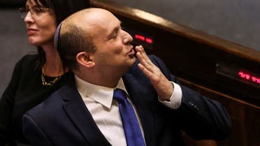Naftali Bennett, Prime Minister-designate, gestures at the Knesset, Israel's parliament, during a special session whereby a confidence vote will be held to approve and swear-in a new coalition government, in Jerusalem . (Reuters)