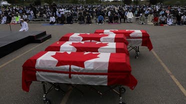 Flag-wrapped coffins are seen outside the Islamic Centre of Southwest Ontario, during a funeral of the Afzaal family that was killed in what Canadian PM Trudeau describes as a “terrorist attack”, in London, Ontario, Canada June 12, 2021. (Reuters/Carlos Osorio)