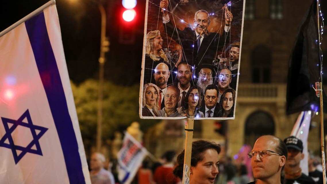 Protesters take part in a weekly demonstration against Israeli Prime Minister Benjamin Netanyahu, on potentially the last day of his premiership, near his official residence in Jerusalem June 12, 2021. REUTERS/Ammar Awad