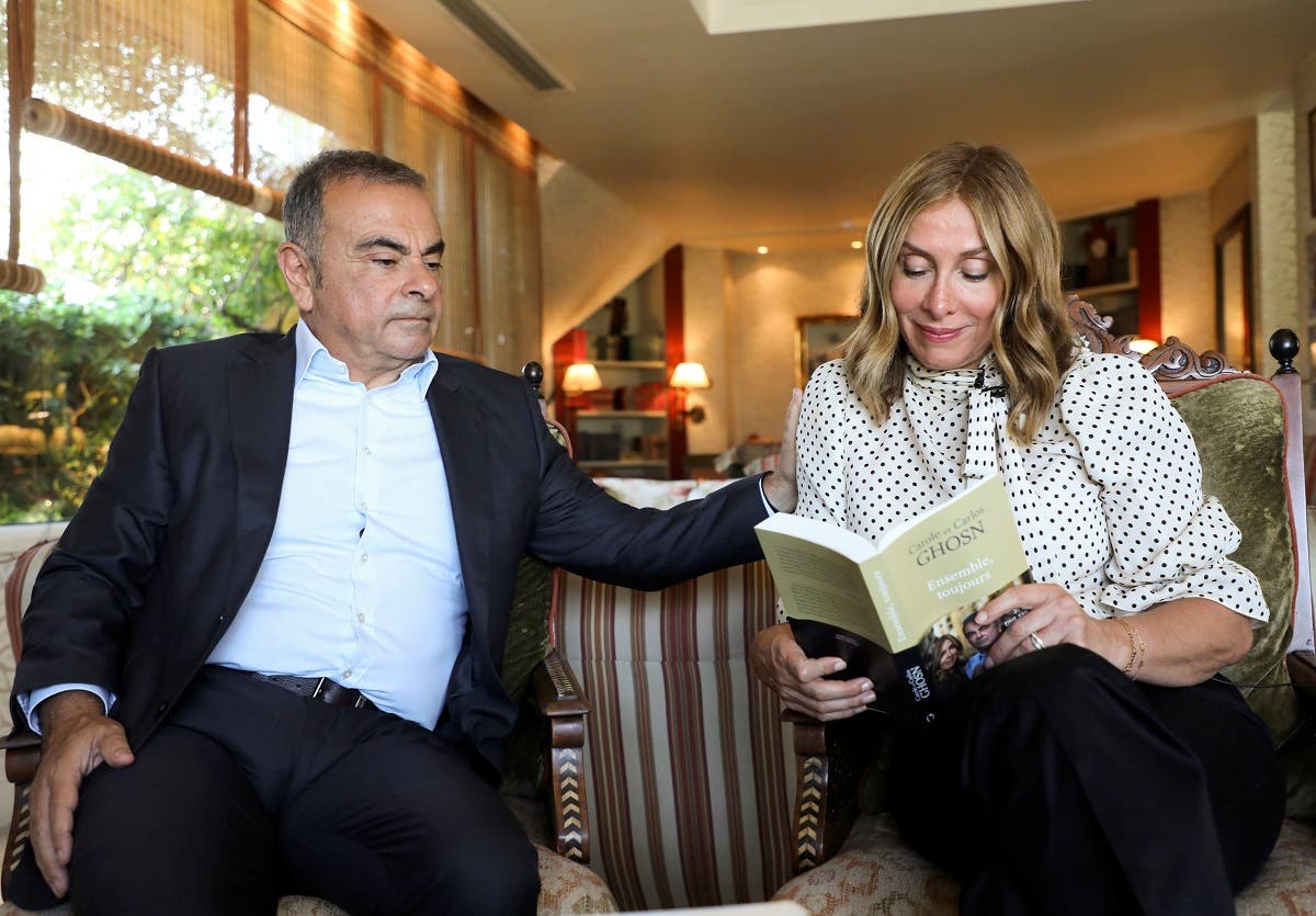 Carole Ghosn, wife of  former car executive Carlos Ghosn, holds their latest book ‘Ensemble toujours’ during an interview with Reuters in Beirut, Lebanon, on June 14, 2021. (Reuters)