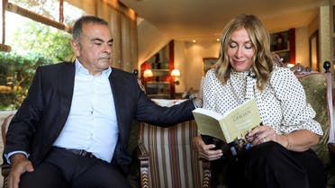 Carole Ghosn, wife of  former car executive Carlos Ghosn, holds their latest book ‘Ensemble toujours’ during an interview with Reuters in Beirut, Lebanon, on June 14, 2021. (Reuters)