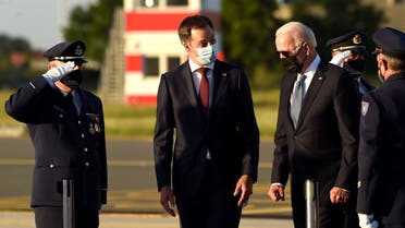 Belgium’s PM Alexander De Croo welcomes US President Joe Biden as he arrives ahead of a NATO summit, at Brussels Military Airport in Melsbroek, Belgium June 13, 2021. (Didier Lebrun/Pool via Reuters)
